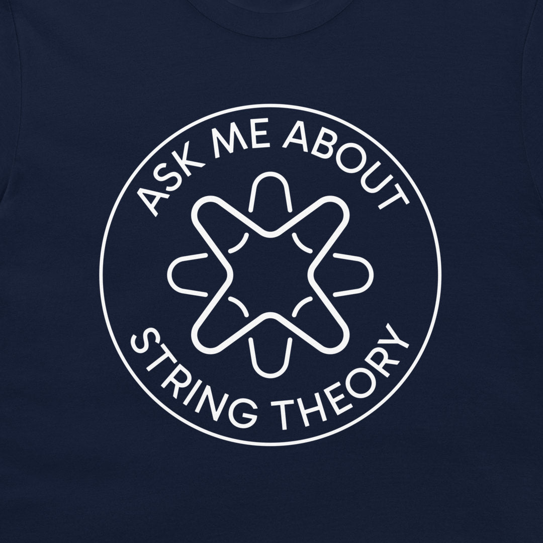 A close-up of a navy blue t-shirt, featuring a white circular graphic with the text 'ASK ME ABOUT STRING THEORY' surrounding a stylized geometric emblem.