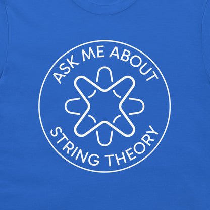 A close-up of a royal blue t-shirt featuring a white circular graphic with the text 'ASK ME ABOUT STRING THEORY' and a stylized graphic.