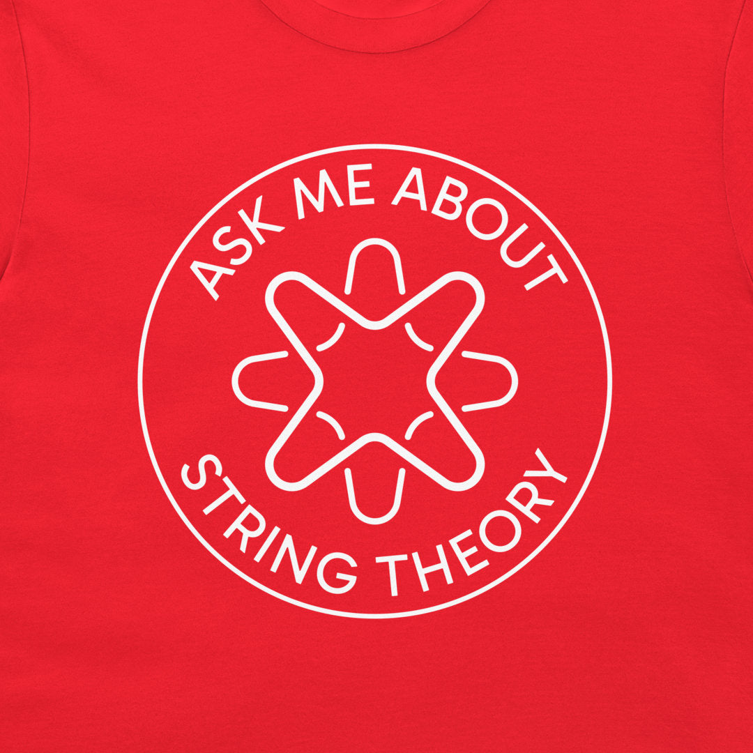 A close-up of a bright red t-shirt featuring a white circular graphic with the text 'ASK ME ABOUT STRING THEORY' surrounding a stylized graphic.