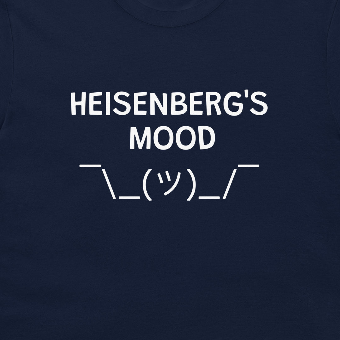 A close-up of a Heisenberg’s Mood minimalist science humor t-shirt on navy blue shirt.