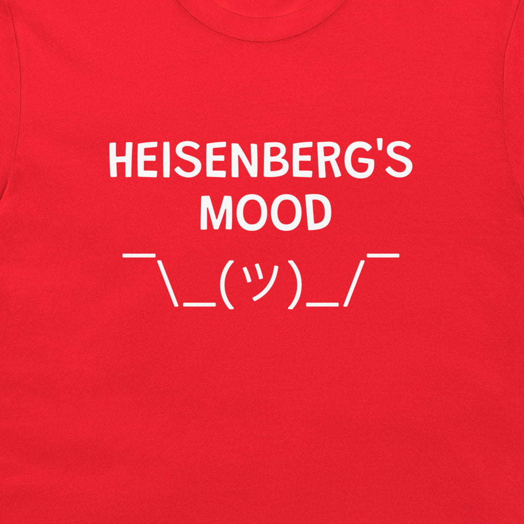 A close-up of a Heisenberg’s Mood quantum physics joke t-shirt on red shirt