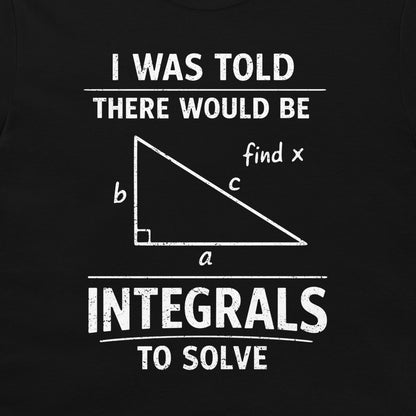 A black graphic t-shirt featuring a white distressed print that reads 'I WAS TOLD THERE WOULD BE INTEGRALS TO SOLVE' with a right-angled triangle diagram in the center labeled 'find x'.
