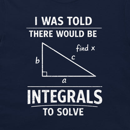 A close-up of a navy blue t-shirt, featuring a white distressed graphic print that reads 'I WAS TOLD THERE WOULD BE INTEGRALS TO SOLVE' with a right-angled triangle diagram labeled a, b, c, and 'find x'.
