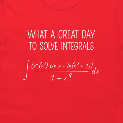 A close-up of a bright red T-shirt with white printed text and a mathematical integral equation reading 'WHAT A GREAT DAY TO SOLVE INTEGRALS'.