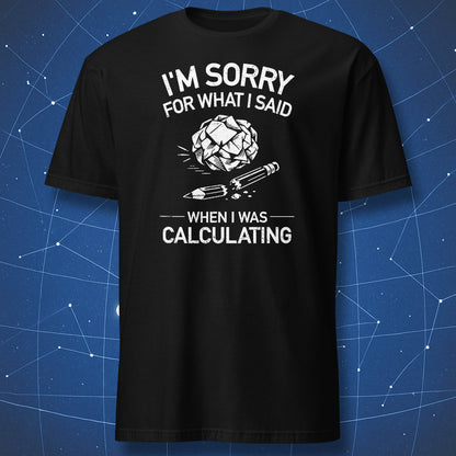 Black t-shirt with white print reading "I'm sorry for what I said when I was calculating" with crumpled paper and broken pencil graphic