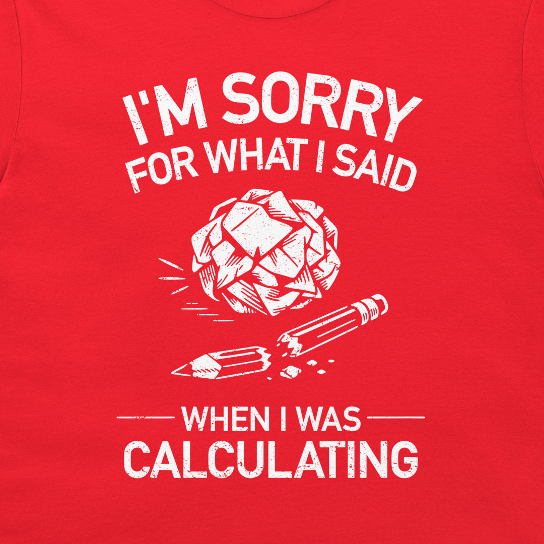 A close-up of a red t-shirt, featuring a white distressed graphic print that reads 'I'M SORRY FOR WHAT I SAID WHEN I WAS CALCULATING' with an illustration of a broken brain and pencil.