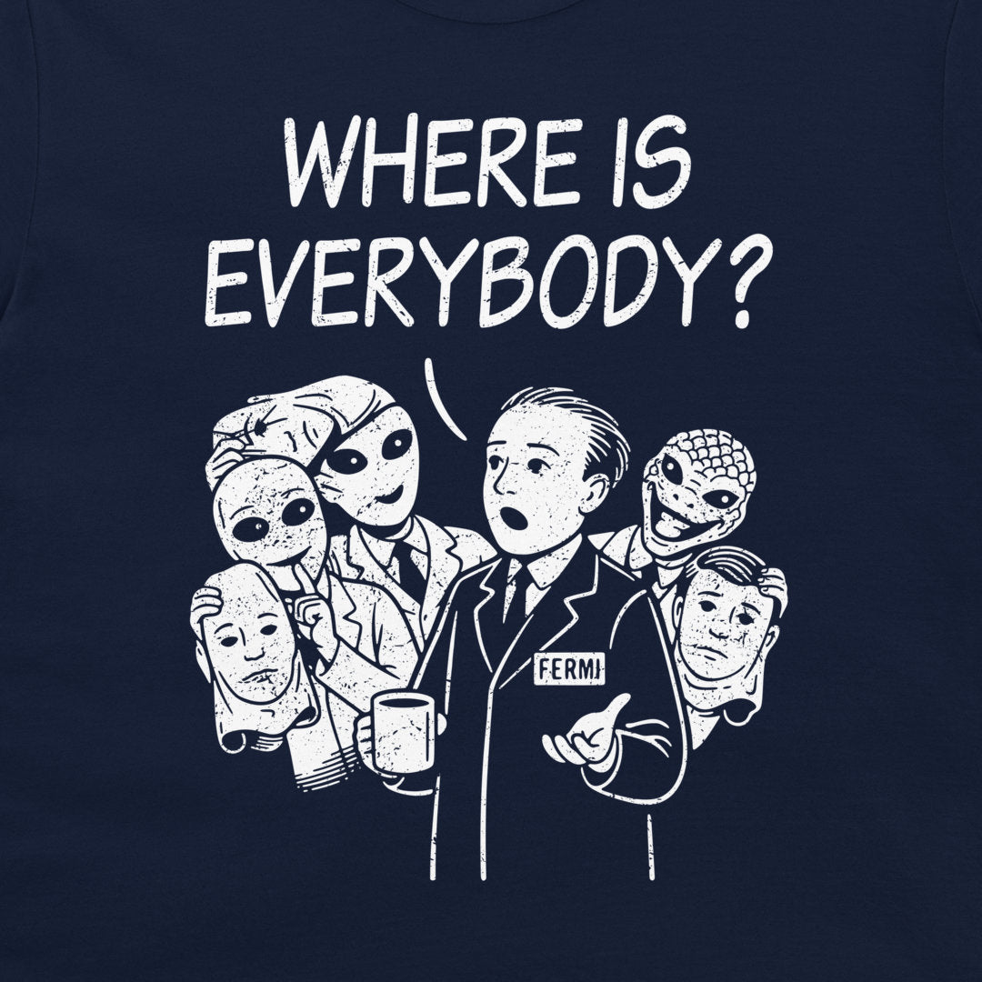 A navy blue t-shirt featuring a white graphic print of Enrico Fermi surrounded by aliens, with the text 'WHERE IS EVERYBODY?' above them.