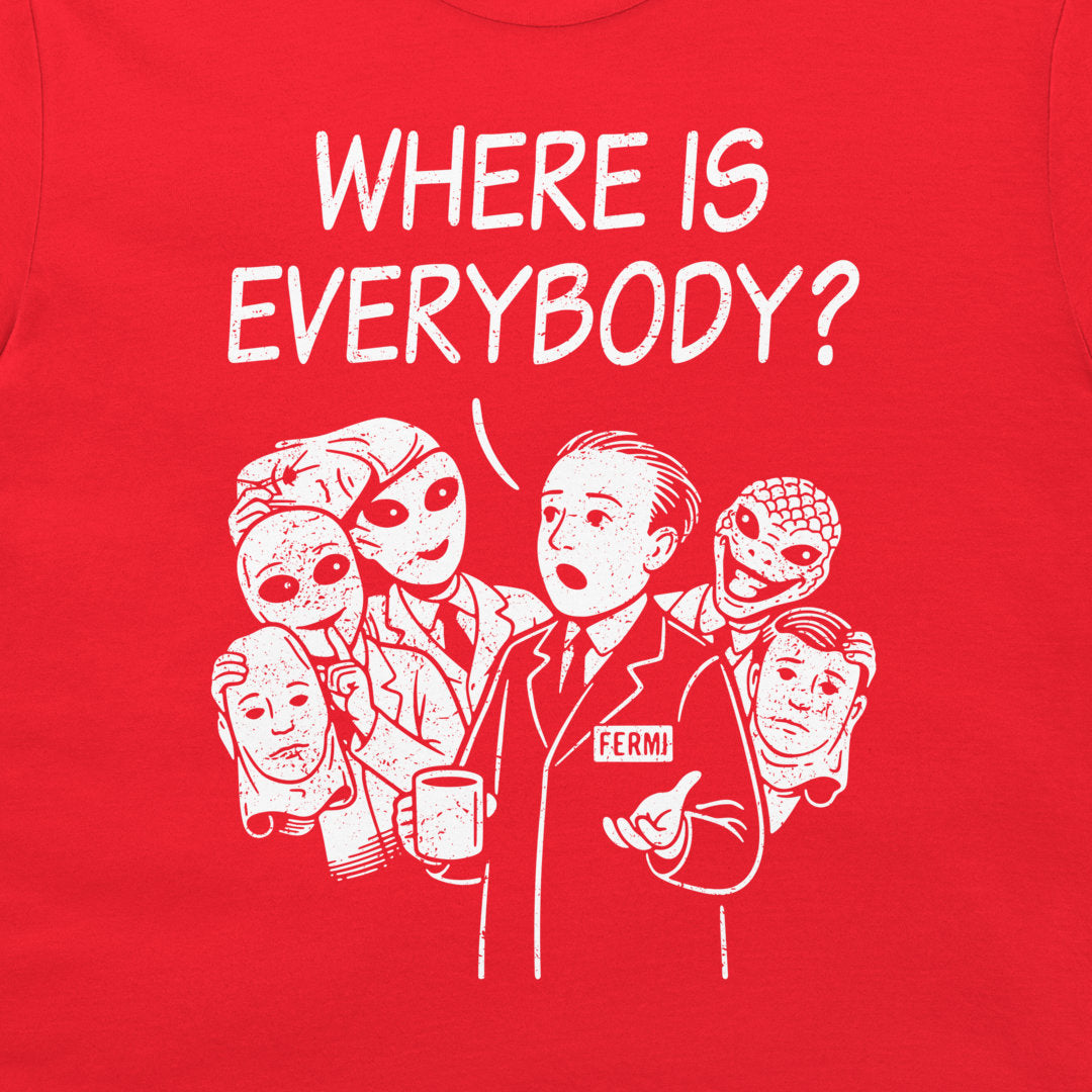 A close-up of a bright red garment, likely a t-shirt, featuring a white graphic print of Enrico Fermi with the text 'WHERE IS EVERYBODY?' above him.