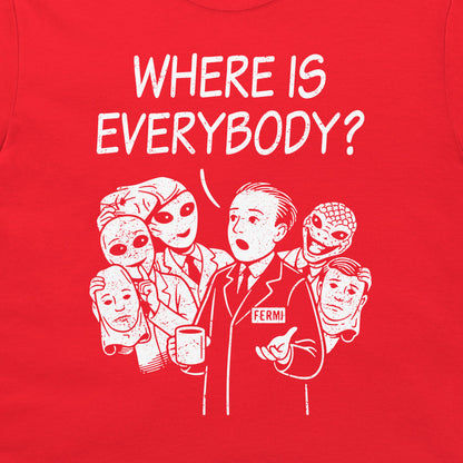 A close-up of a bright red garment, likely a t-shirt, featuring a white graphic print of Enrico Fermi with the text 'WHERE IS EVERYBODY?' above him.