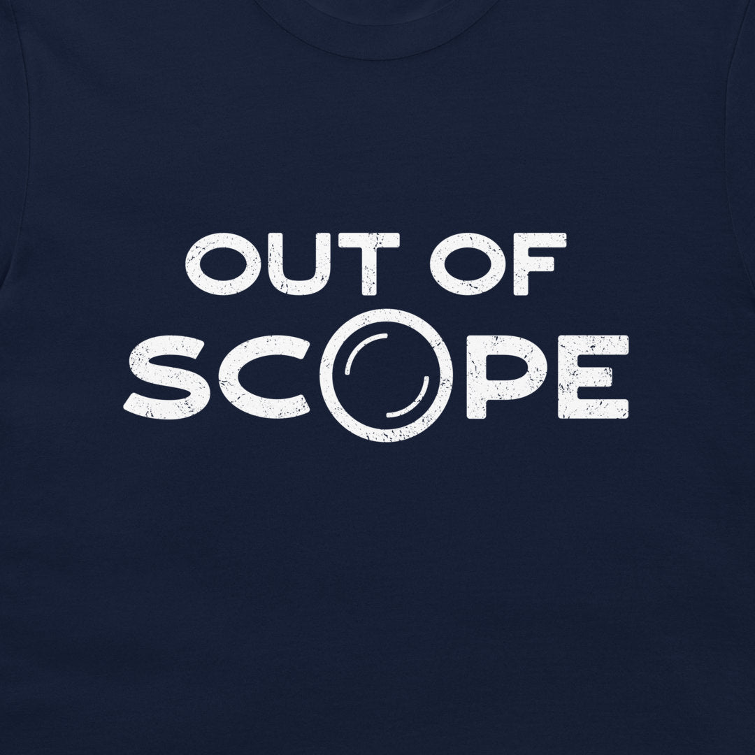 A close-up of a navy blue t-shirt featuring a distressed white graphic print that reads 'OUT OF SCOPE' with the letter 'O' stylized as a telescope lens.