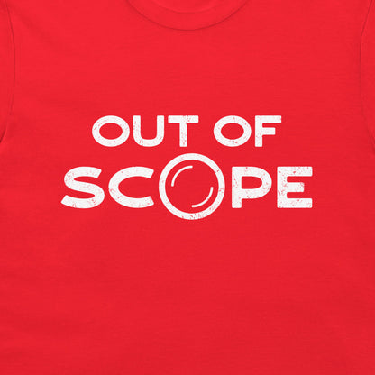 A close-up of a bright red t-shirt, featuring a distressed white graphic print that reads 'OUT OF SCOPE' with the letter 'O' stylized as a camera lens.