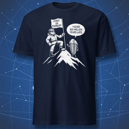 Cartoon Everest climber with flag and trilobite joke about being 500 million years late on navy blue shirt