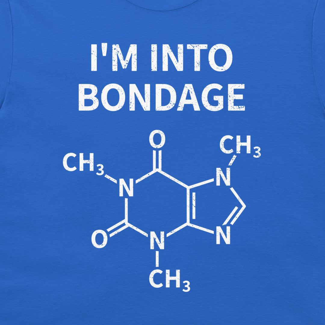 A close-up of a blue t-shirt featuring a white graphic print. The text reads 'I'M INTO BONDAGE' above a chemical structure diagram of caffeine.