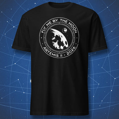 Black t-shirt with Fly Me By The Moon Artemis II 2026 design featuring Moon flyby spacecraft window and Earth in distance