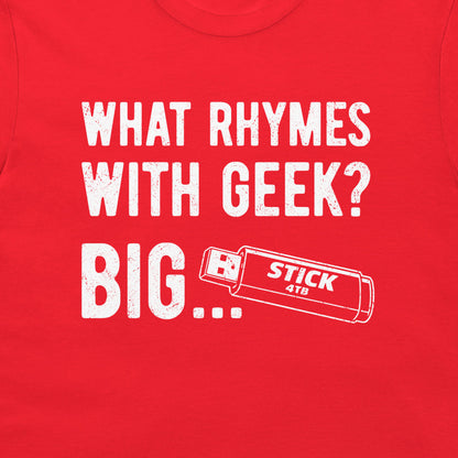 A close-up of a bright red t-shirt featuring a white distressed graphic that reads 'WHAT RHYMES WITH GEEK? BIG..' and a USB stick graphic.