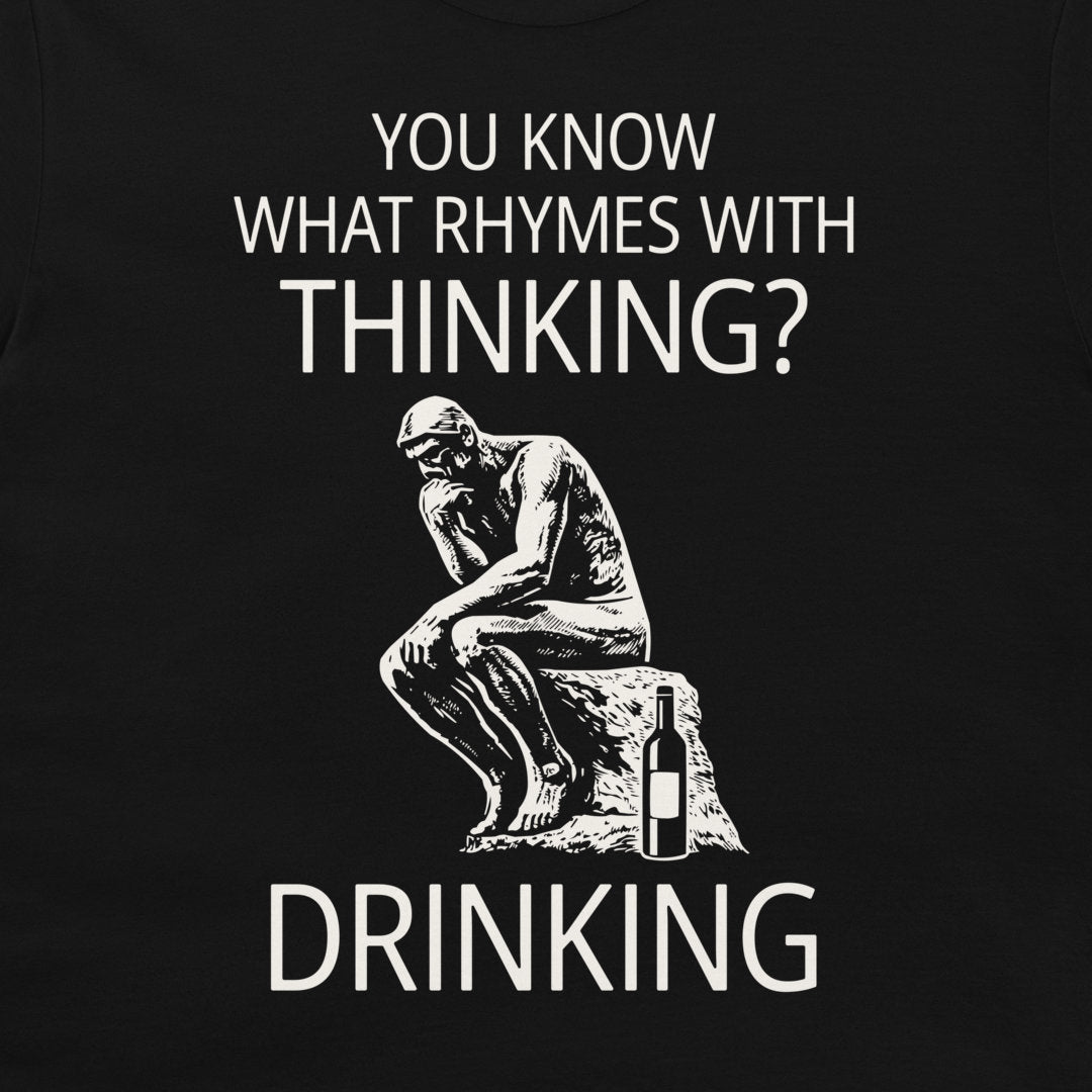 A black graphic t-shirt featuring a white print of the Thinker statue next to a wine bottle, with the text 'YOU KNOW WHAT RHYMES WITH THINKING? DRINKING'.