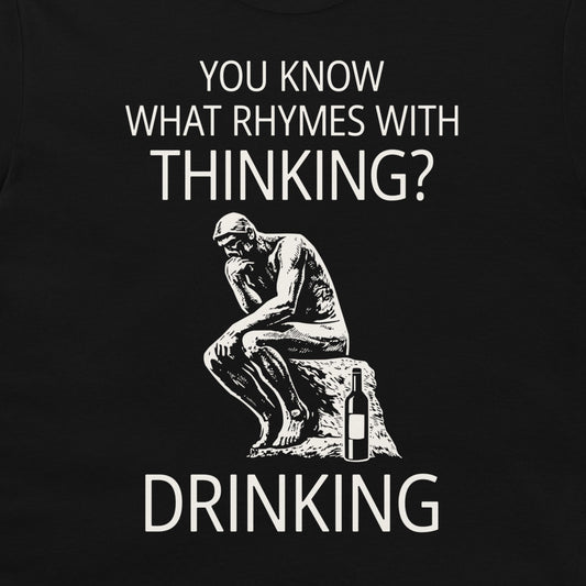 A black graphic t-shirt featuring a white print of the Thinker statue next to a wine bottle, with the text 'YOU KNOW WHAT RHYMES WITH THINKING? DRINKING'.