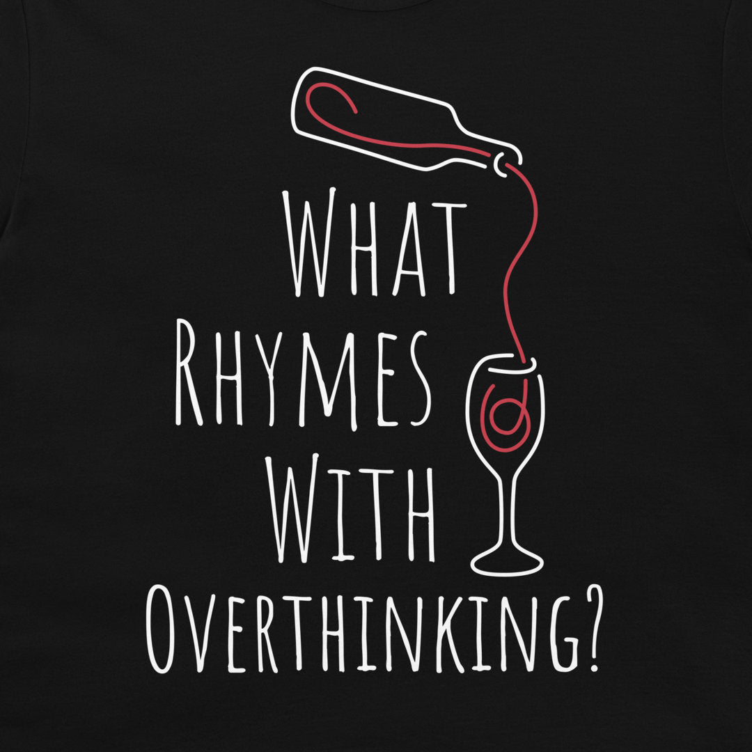 A close-up of a black graphic t-shirt featuring a white hand-drawn style design of a bottle pouring red liquid into a wine glass, with the text 'WHAT RHYMES WITH OVERTHINKING?' printed below.