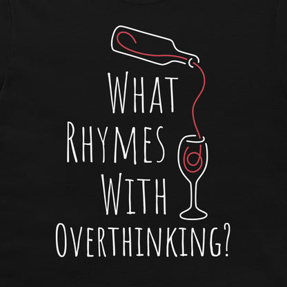 A close-up of a black graphic t-shirt featuring a white hand-drawn style design of a bottle pouring red liquid into a wine glass, with the text 'WHAT RHYMES WITH OVERTHINKING?' printed below.