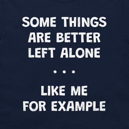 A close-up of a navy blue garment, likely a t-shirt, featuring a humorous white distressed text graphic that reads 'SOME THINGS ARE BETTER LEFT ALONE. LIKE ME FOR EXAMPLE'.