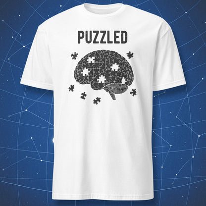 black brain puzzle graphic with missing pieces and “Puzzled” text on white shirt