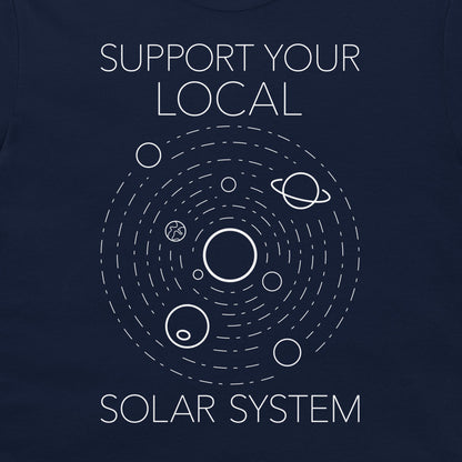 A close-up of a navy blue t-shirt featuring a white graphic of the solar system with the text 'SUPPORT YOUR LOCAL SOLAR SYSTEM'.