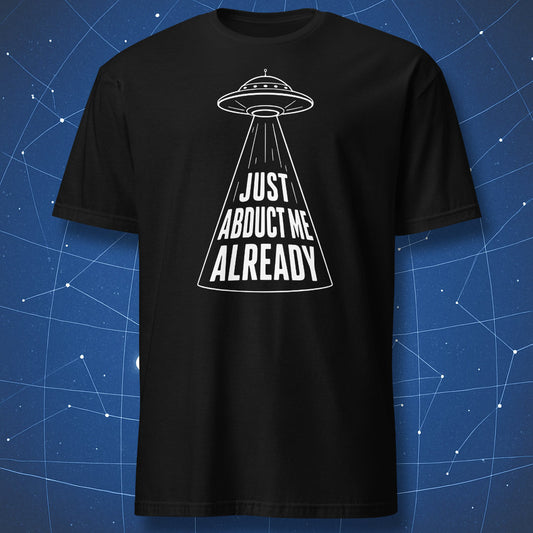 Black t-shirt with minimalist UFO beam design and “Just Abduct Me Already” text