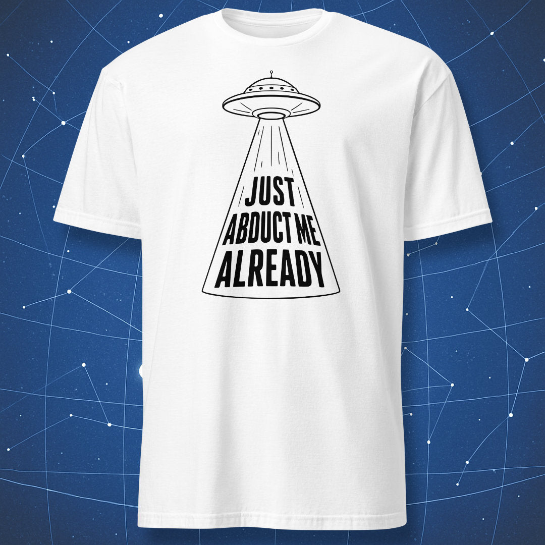 White t-shirt with black UFO design and “Just Abduct Me Already” slogan