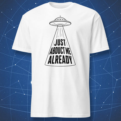 White t-shirt with black UFO design and “Just Abduct Me Already” slogan