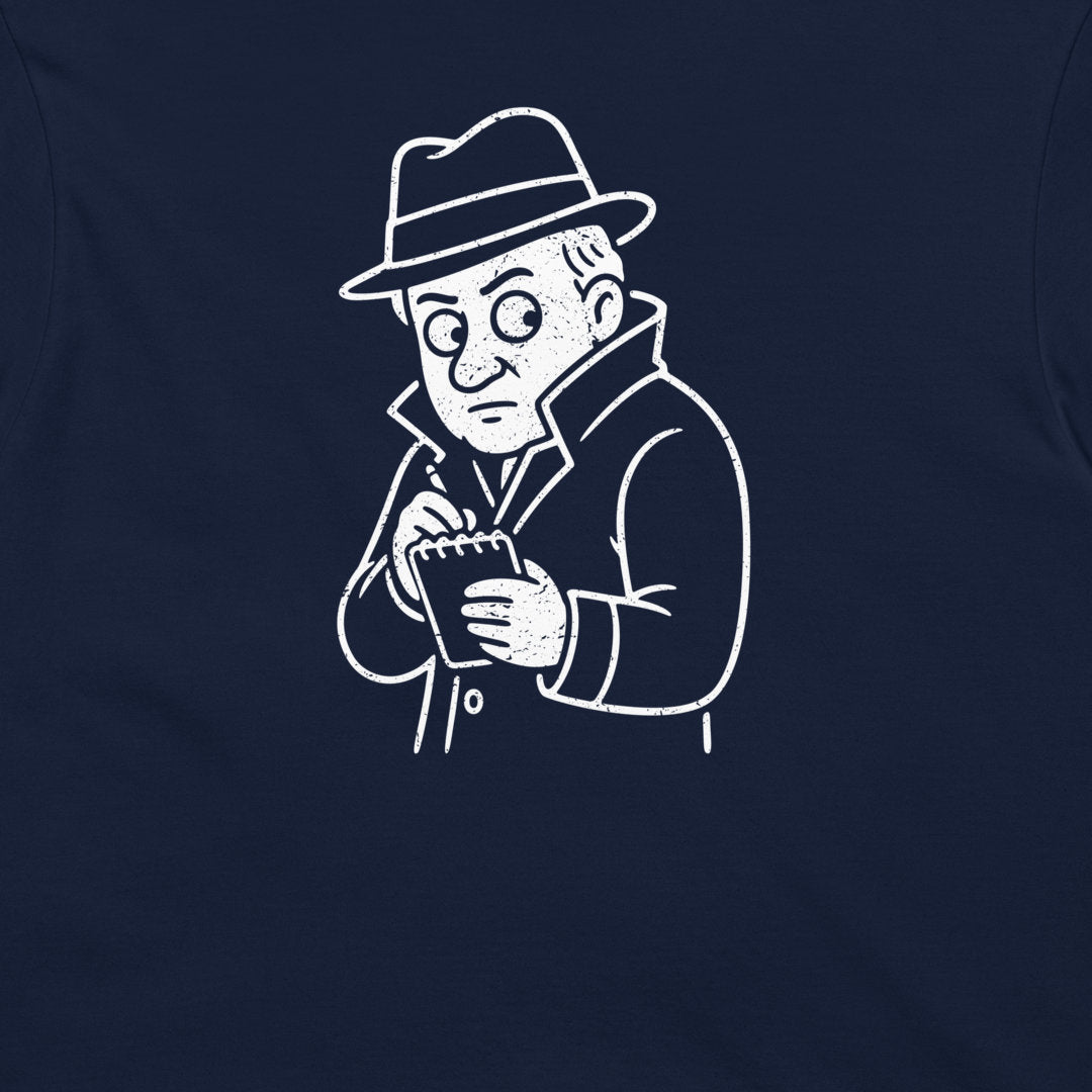 A close-up of a navy blue t-shirt back, featuring a white line-art graphic of Edison in a fedora hat looking down at a notebook.