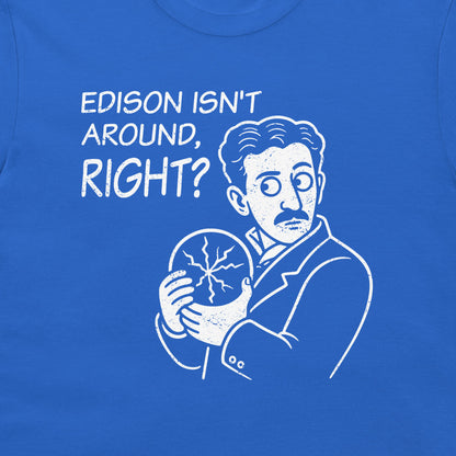 A close-up of a royal blue t-shirt featuring a white graphic print of a cartoon Tesla, with the text 'EDISON ISN'T AROUND, RIGHT?' printed above.