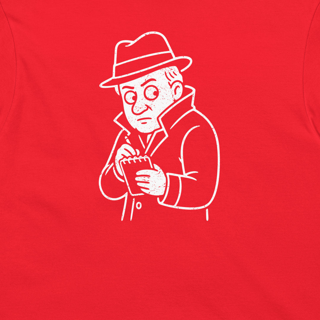 A close-up of a bright red t-shirt back, featuring a white line-art graphic of Thomas Edison in a fedora holding a notebook.