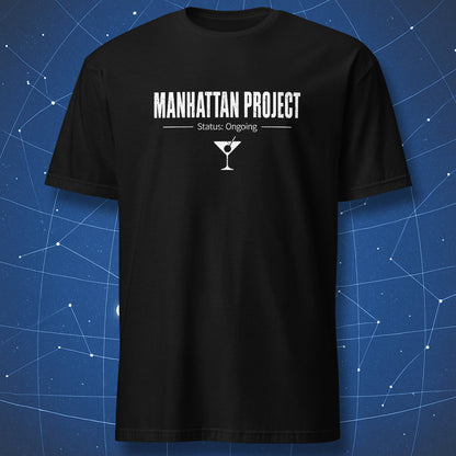 Manhattan Project Status Ongoing science humor t-shirt with Manhattan cocktail graphic on black shirt