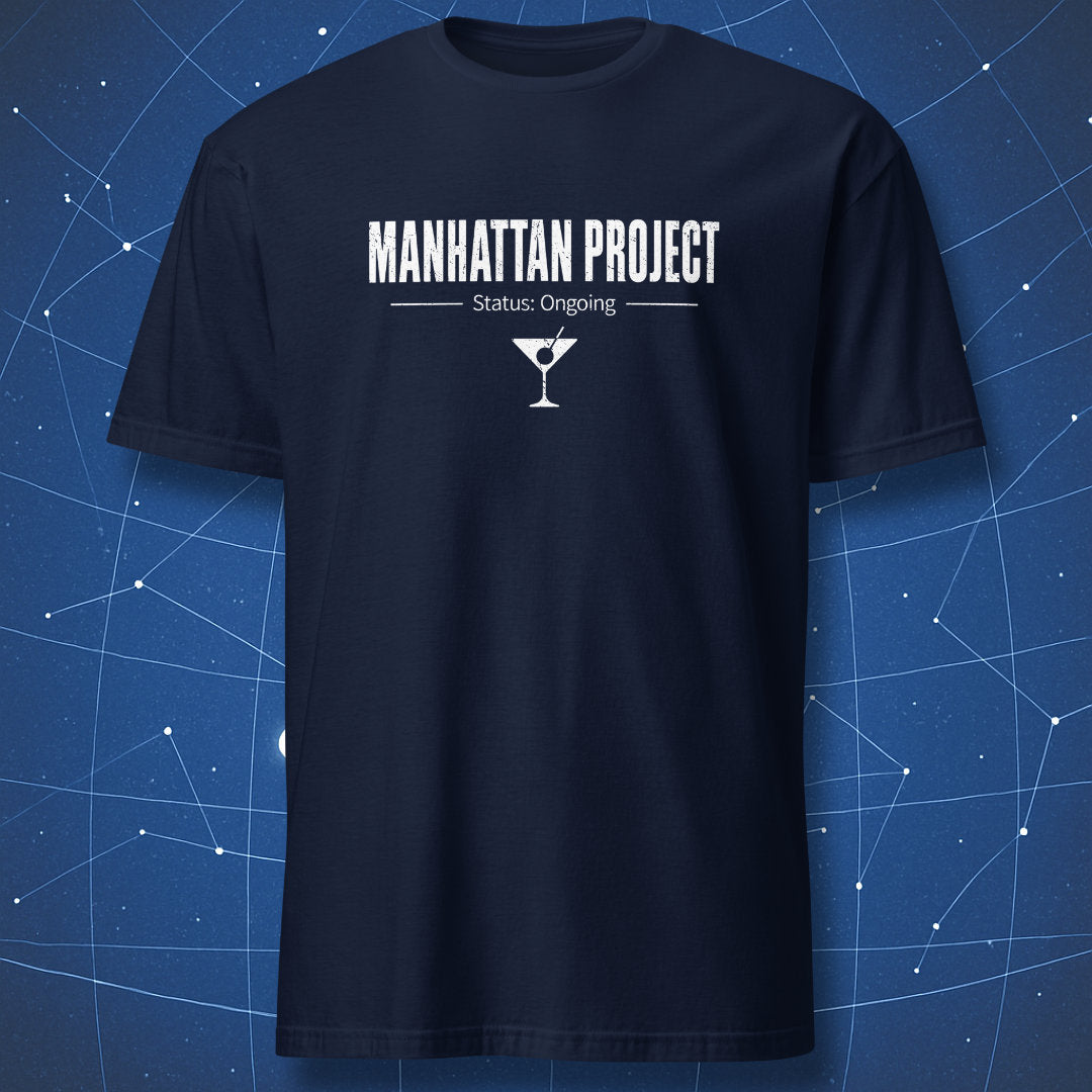 Physics and cocktail inspired Manhattan Project Status Ongoing graphic tee on navy shirt