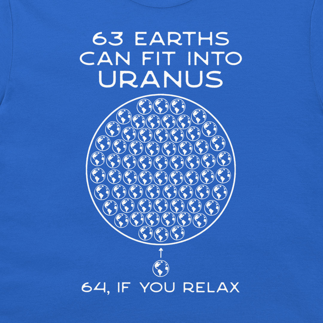 A close-up of a royal blue t-shirt featuring a white graphic print. The design displays the text '63 EARTHS CAN FIT INTO URANUS' above a circular arrangement of globe icons, with '64, IF YOU RELAX' written below.