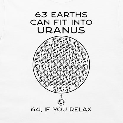 A white graphic t-shirt featuring a black printed design that reads '63 EARTHS CAN FIT INTO URANUS' above a circular arrangement of globe icons, with '64, IF YOU RELAX' printed below.