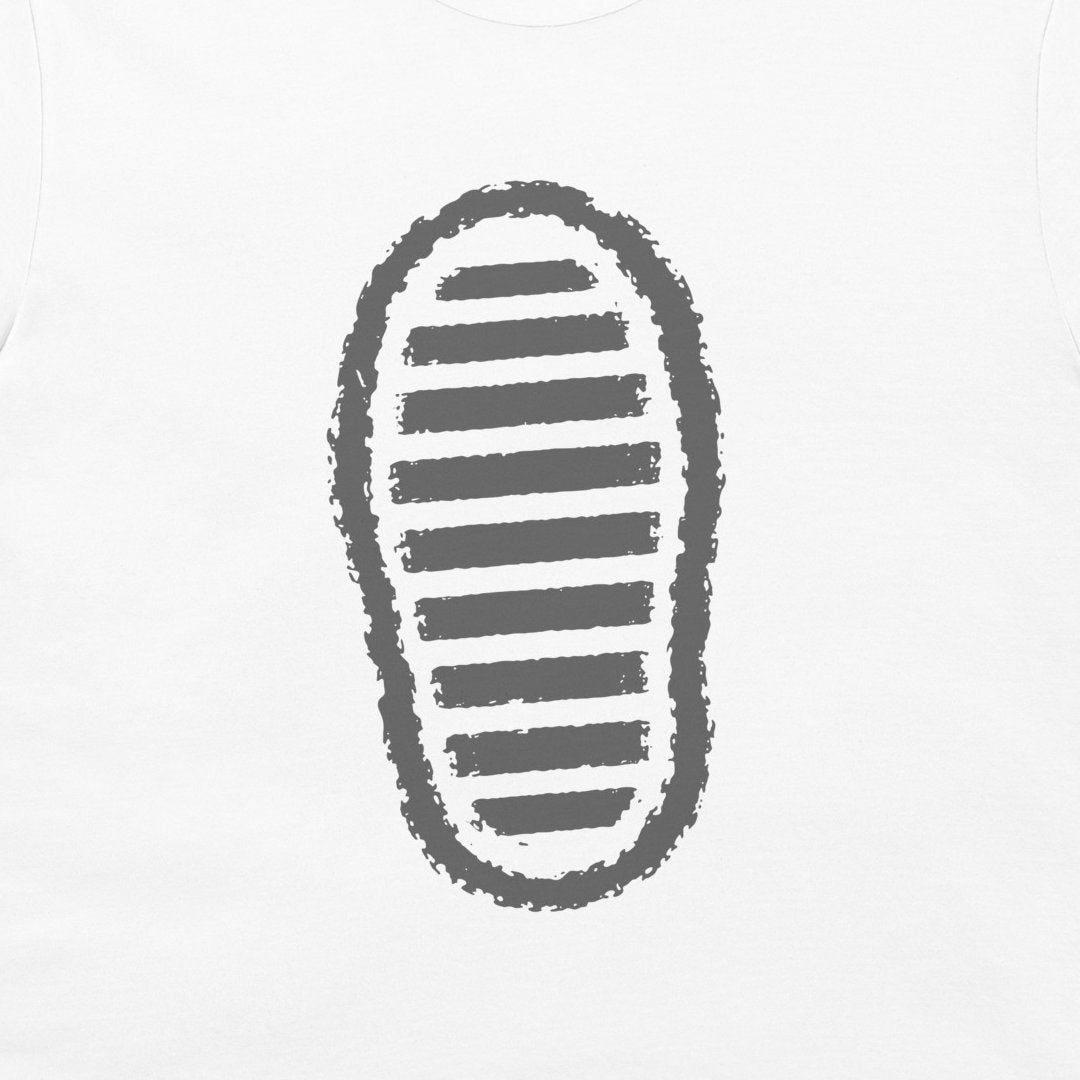 A close-up of a white-shirt, featuring a dark grey graphic print of a shoe sole with horizontal stripes.