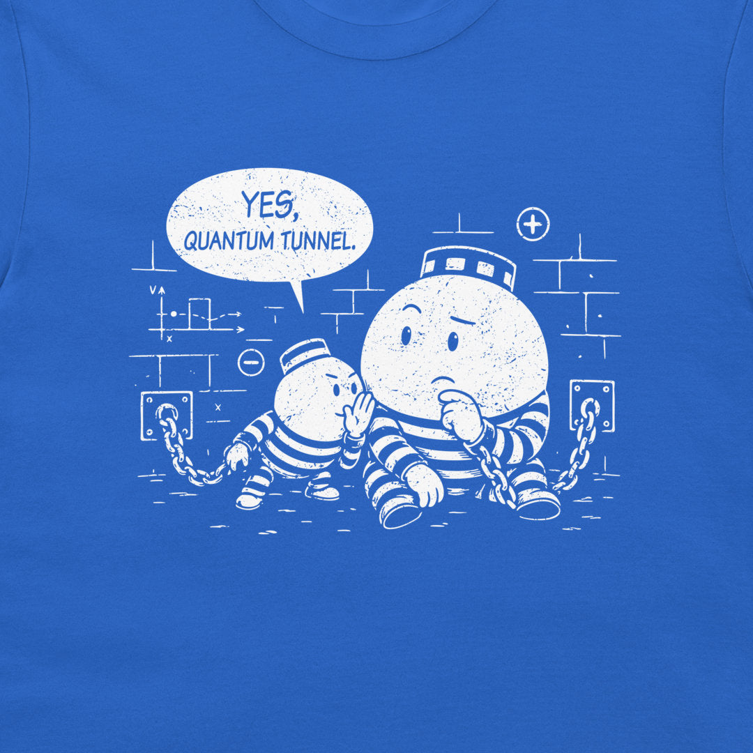A close-up of a blue T-shirt featuring a white distressed graphic of two cartoon prisoner particles in striped jumpsuits, one with a head through a lock and the other saying 'YES, QUANTUM TUNNEL' in a speech bubble.
