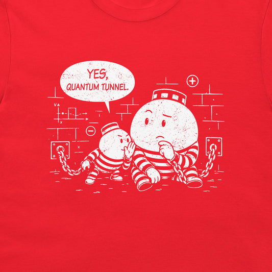 A close-up of a bright red t-shirt, featuring a white distressed graphic of two cartoon particles in striped prison uniforms with a speech bubble that reads 'YES, QUANTUM TUNNEL'.
