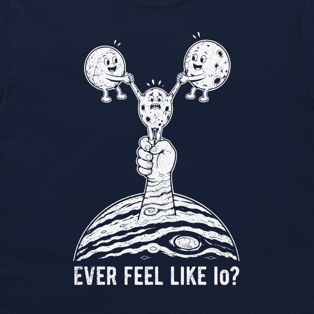 A navy blue t-shirt featuring a white graphic of a Jupiter hand holding a cratered moon, with two smaller cartoon moons on its shoulders, and the text 'EVER FEEL LIKE IO?' printed below.
