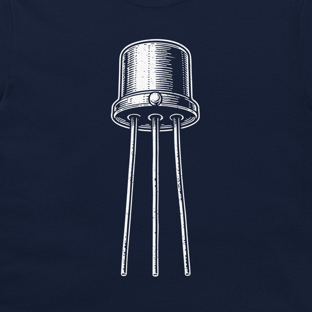 A close-up of a dark navy blue t-shirt, featuring a white hand-drawn style graphic of an electronic transistor component.