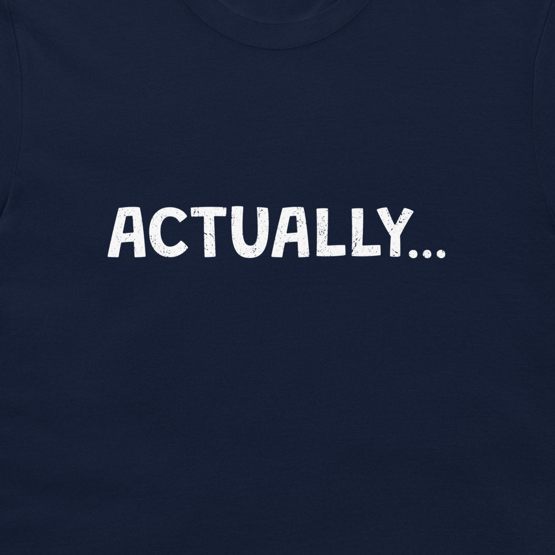 Close-up of a navy blue T-shirt with the word 'ACTUALLY...'