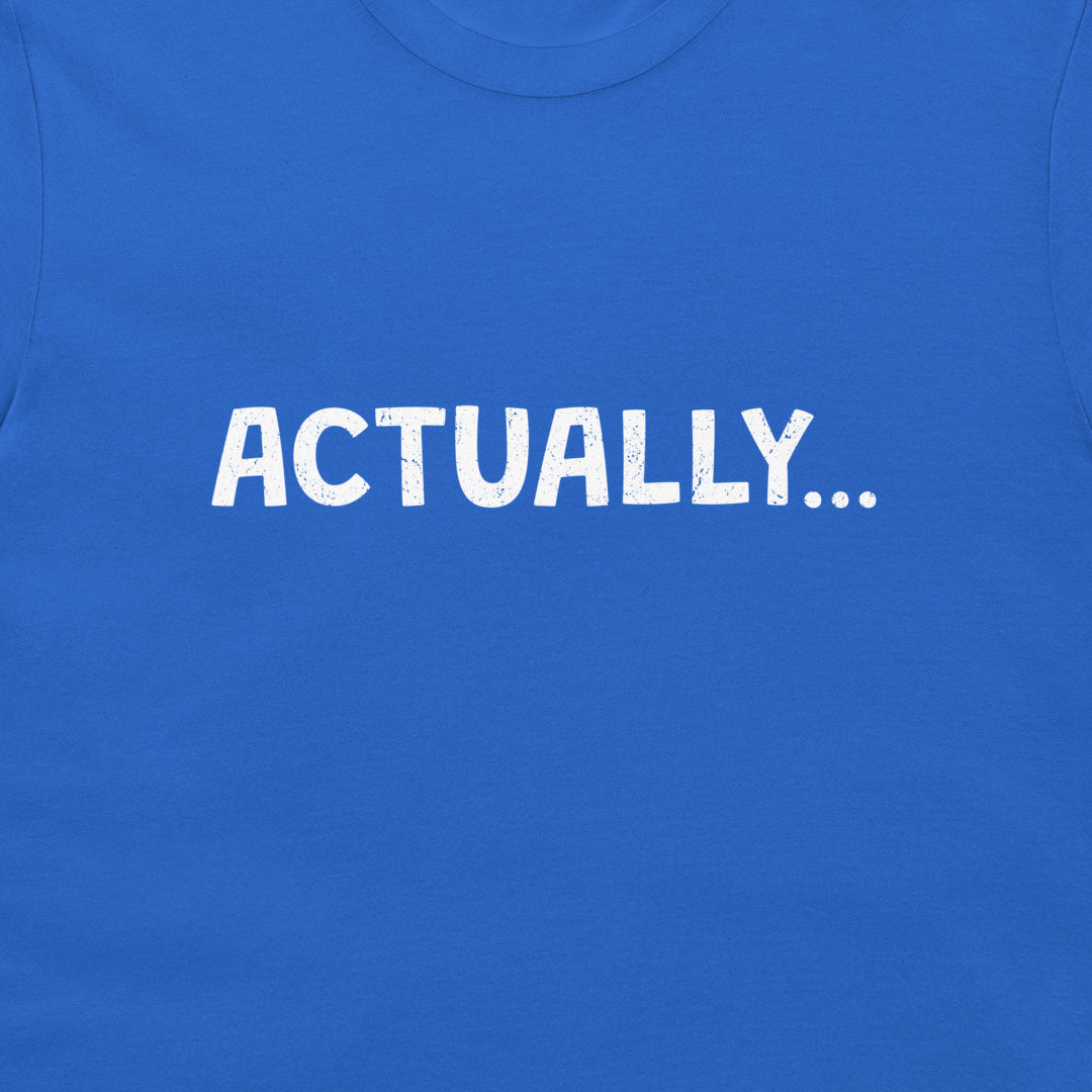 A close-up of a bright blue t-shirt featuring the word 'ACTUALLY...'