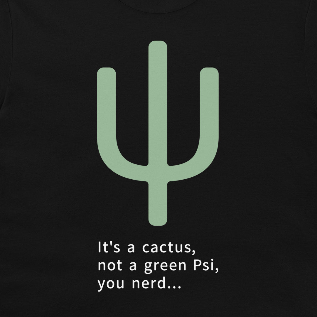 A close-up of a black t-shirt featuring a light green cactus graphic and the white printed text 'It's a cactus, not a green Psi, you nerd.