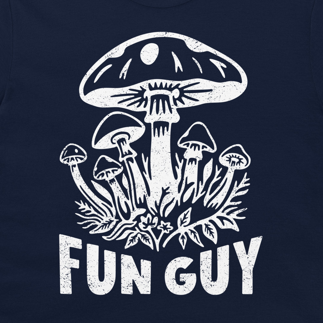 A close-up of a navy blue t-shirt, featuring a distressed white graphic of mushrooms and the text 'FUN GUY'.
