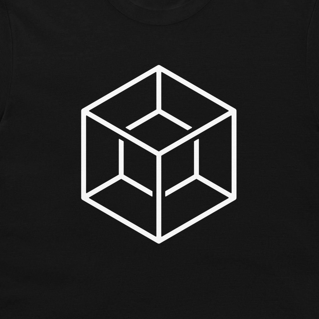 A close-up of a black t-shirt, featuring a white minimalist line art graphic of an impossible geometric cube in the center.