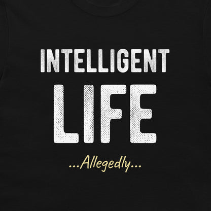 A close-up of a black t-shirt featuring a white graphic print that reads 'INTELLIGENT LIFE ...Allegedly...' in stylized fonts.