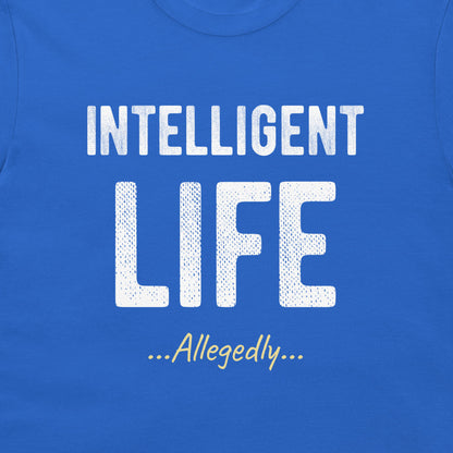 A close-up of a blue t-shirt featuring a white graphic print that reads 'INTELLIGENT LIFE ...Allegedly...' in stylized fonts.