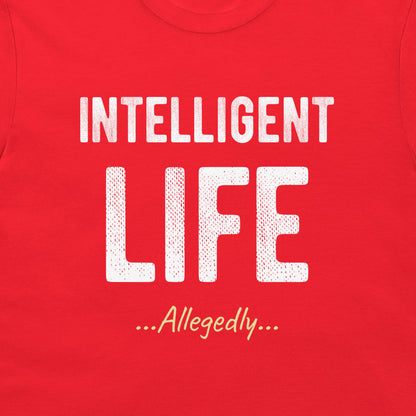 A close-up of a red t-shirt featuring a white graphic print that reads 'INTELLIGENT LIFE ...Allegedly...' in stylized fonts.