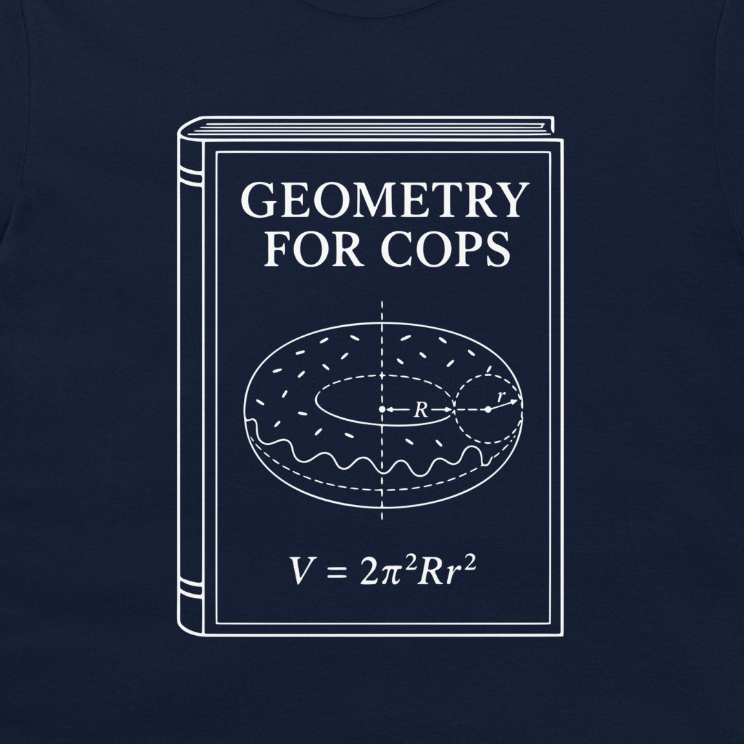 A navy blue t-shirt featuring a white graphic print of a book titled 'GEOMETRY FOR COPS' with a donut illustration and the formula V = 2π²Rr².